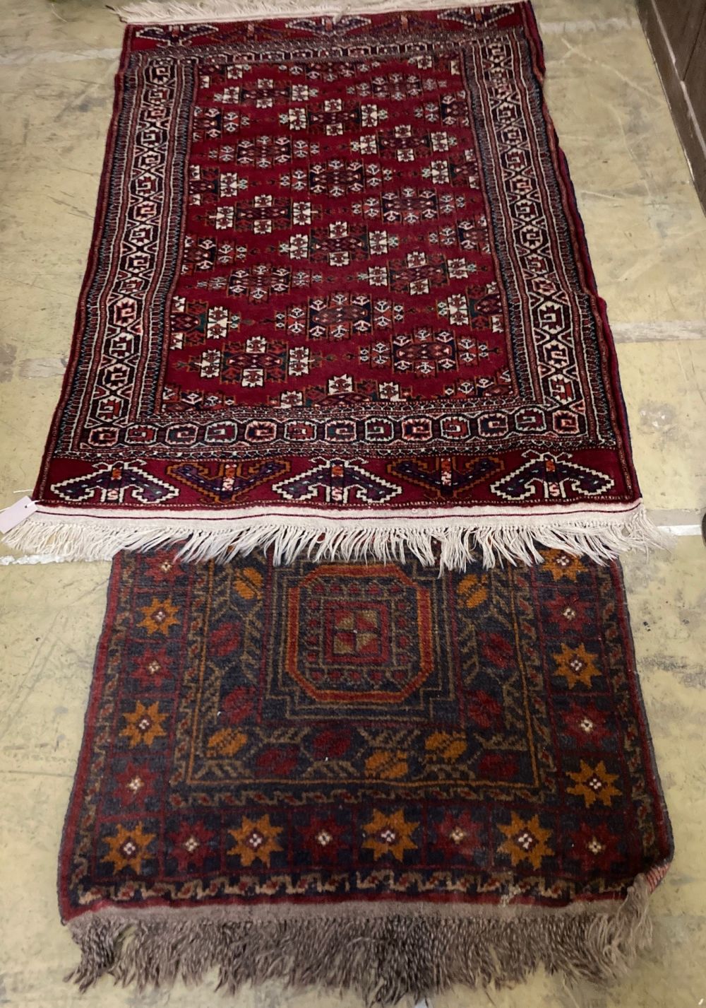 A Bokhara rug and a Turkish geometric rug, larger 150 x 100cm